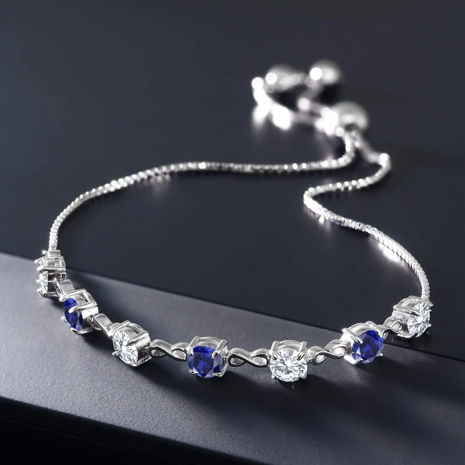 Gem Stone King 4.5MM Round Gemstone Birthstone and White Moissanite Infinity Tennis Bracelet for Women | 925 Sterling Silver | Fully Adjustable to 9 Inch | Fine Jewelry for Her Mom Wife